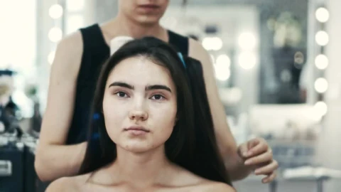 Stock Video Pair Of Makeup Artists Working On A Young Woman Live Wallpaper - Free Live Wallpaper