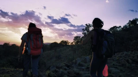 Stock Video Pair Of Mountaineers Leaving Through Nature At Sunset Live Wallpaper - Free Live Wallpaper