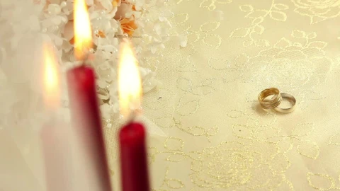 Stock Video Pair Of Rings Beside Plastic Flowers And Candles Live Wallpaper - Free Live Wallpaper