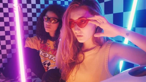 Stock Video Pair Of Stylish Girls Posing Captivatingly Live Wallpaper - Free Live Wallpaper