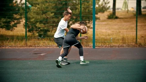 Stock Video Pair Of Young Men Playing Basketball In A Park Live Wallpaper - Free Live Wallpaper