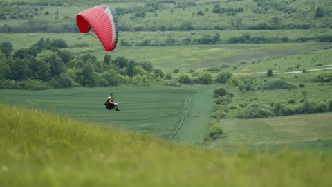 Stock Video Paraglider Floats Over Green Countryside Live Wallpaper - Free Live Wallpaper
