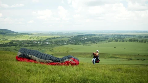 Stock Video Paraglider Lifts Off Over Open Field Live Wallpaper - Free Live Wallpaper