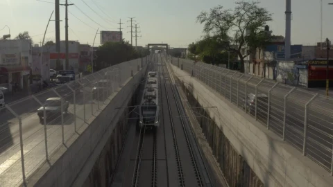 Stock Video Passenger Train Traveling Between The Streets Of A City Live Wallpaper - Free Live Wallpaper