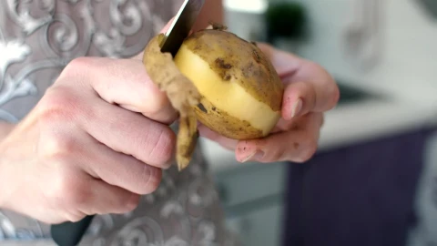 Stock Video Peeling A Potato With A Knife Live Wallpaper - Free Live Wallpaper