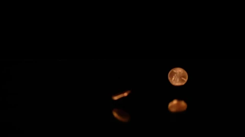 Stock Video Pennies Falling On A Reflective Surface With A Dark Background Live Wallpaper - Free Live Wallpaper