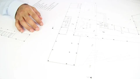 Stock Video People Hands Unrolling A Blueprint On A Table Live Wallpaper - Free Live Wallpaper