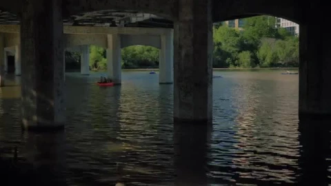 Stock Video People Rowing In A River Under A Large Bridge Live Wallpaper - Free Live Wallpaper