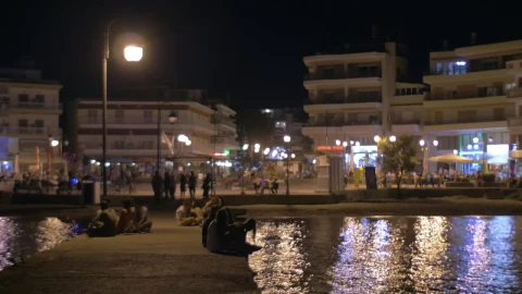 Stock Video People Sitting On A City Pier Live Wallpaper - Free Live Wallpaper