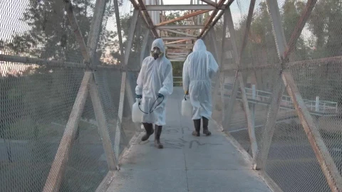 Stock Video People With Masks Sanitizing A Pedestrian Bridge Live Wallpaper - Free Live Wallpaper
