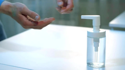Stock Video Person Applying Alcohol Gel On Their Hands Live Wallpaper - Free Live Wallpaper