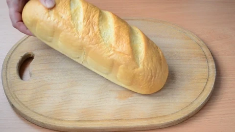 Stock Video Person Cutting Bread On A Board Live Wallpaper - Free Live Wallpaper
