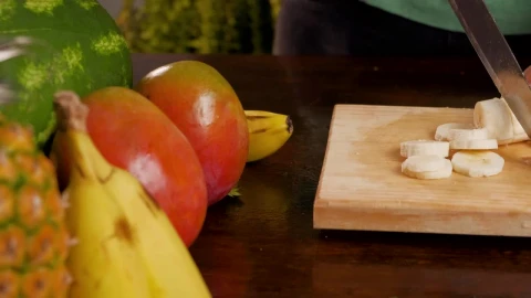 Stock Video Person Cutting Banana For A Fruit Cocktail Live Wallpaper - Free Live Wallpaper