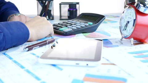 Stock Video Person Doing Accounts And Graphs On A Table Live Wallpaper - Free Live Wallpaper