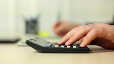 Stock Video Person Doing Calculations With A Calculator Live Wallpaper - Free Live Wallpaper