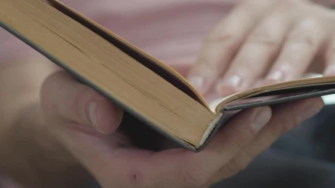 Stock Video Person Flipping Through A Book Looking For A Page Live Wallpaper - Free Live Wallpaper