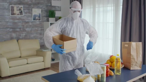 Stock Video Person In Coronavirus Quarantine Packs Food Into Box Live Wallpaper - Free Live Wallpaper