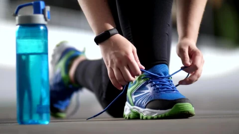 Stock Video Person In Sportswear Tying His Shoelaces Live Wallpaper - Free Live Wallpaper