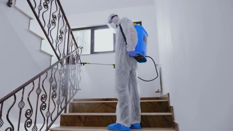 Stock Video Person In Ppe Sanitizing Building During Pandemic Live Wallpaper - Free Live Wallpaper