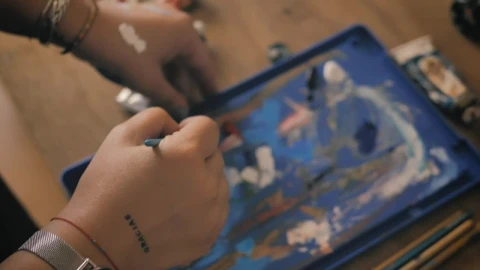 Stock Video Person Mixing Paint On A Table Live Wallpaper - Free Live Wallpaper