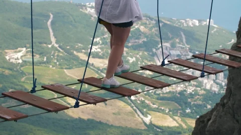 Stock Video Person On A Suspension Bridge Between Mountains Live Wallpaper - Free Live Wallpaper