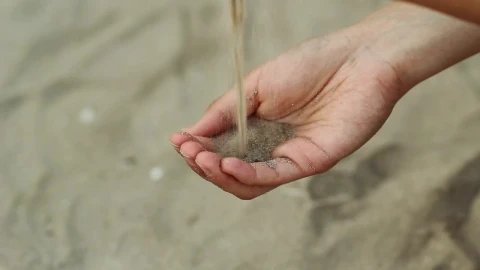 Stock Video Person Passing Sand From One Hand To Another Live Wallpaper - Free Live Wallpaper