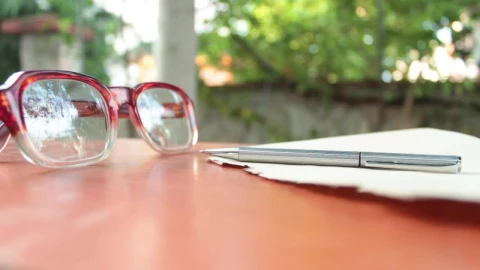 Video Stock Person Takes His Glasses And Write On A Sheet Live Wallpaper Free - Free Live Wallpaper