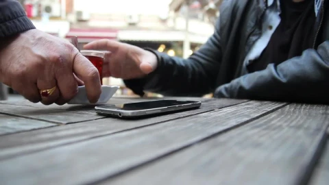 Video Stock Person Using A Mobile Phone While Drinking Tea Live Wallpaper Free - Free Live Wallpaper