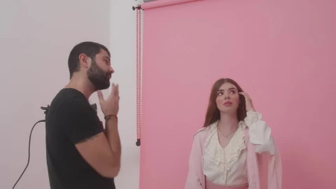 Video Stock Photographer Directing A Model During A Photoshoot Live Wallpaper Free - Free Live Wallpaper