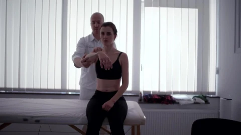 Video Stock Physician Moves Arm Of Female Patient Live Wallpaper Free - Free Live Wallpaper