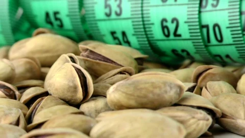 Video Stock Pistachios And A Tape Measure Spinning Close Up Live Wallpaper Free - Free Live Wallpaper