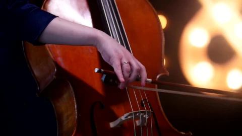 Video Stock Playing The Cello With Blurry Lights In The Background Live Wallpaper Free - Free Live Wallpaper