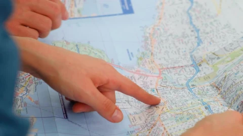 Video Stock Pointing To A Map Of A City With His Hands Live Wallpaper Free - Free Live Wallpaper