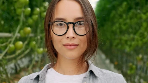 Video Stock Portrait Of An Agricultural Woman With Glasses In A Greenhouse Live Wallpaper Free - Free Live Wallpaper