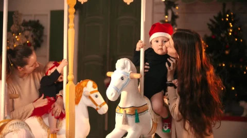Video Stock Portrait Of Two Moms With Their Babies At A Carousel Live Wallpaper Free - Free Live Wallpaper