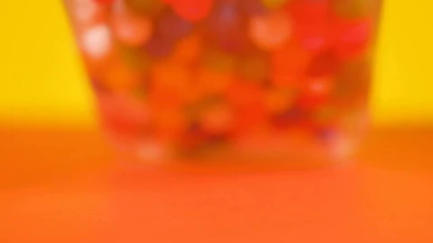 Video Stock Pot With Spilled Sweets On A Yellow Background Live Wallpaper Free - Free Live Wallpaper