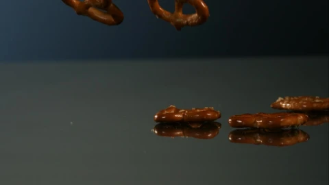 Video Stock Pretzels Falling Into A Mirror Surface Live Wallpaper Free - Free Live Wallpaper
