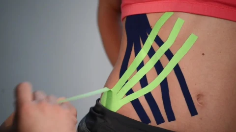 Video Stock Putting Kinesio Tape On An Athletes Hip Live Wallpaper Free - Free Live Wallpaper