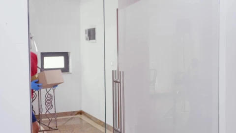 Video Stock Quarantine Delivery Man In Face Mask Hands Woman A Box Live Wallpaper Free - Free Live Wallpaper