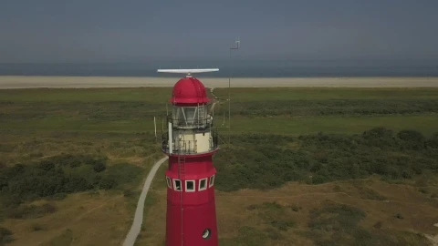 Video Stock Red Lighthouse Near The Shore Spinning Aerial Shot Live Wallpaper Free - Free Live Wallpaper