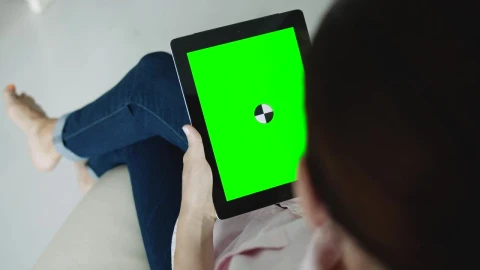 Free Stock Video Sitting Woman Holding Greenscreen Tablet With Chroma Key Live Wallpaper - Free Live Wallpaper