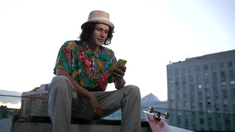 Free Stock Video Skateboarder Checking His Phone Live Wallpaper - Free Live Wallpaper