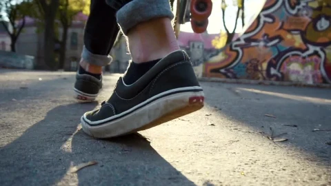 Free Stock Video Skateboarder Walking By In A Park Live Wallpaper - Free Live Wallpaper