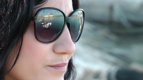 Free Stock Video Relaxed Woman Wearing Glasses By The Seashore Live Wallpaper - Free Live Wallpaper
