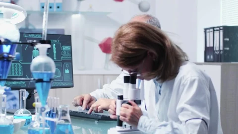 Free Stock Video Research Scientists Collaborate In Modern Lab Live Wallpaper - Free Live Wallpaper