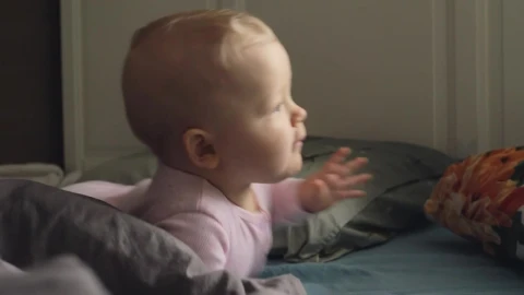 Free Stock Video Restless Baby Smiling At The Camera Live Wallpaper - Free Live Wallpaper
