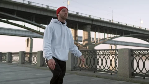 Free Stock Video Runner Does Stretch Routine With City Bridge In Background Live Wallpaper - Free Live Wallpaper