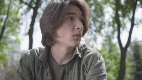 Free Stock Video Sad And Worried Young Man In A Park Live Wallpaper - Free Live Wallpaper