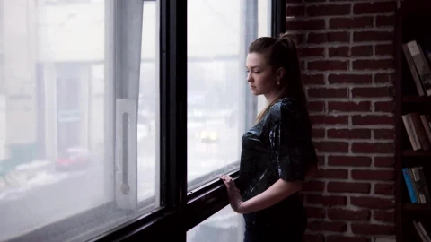 Free Stock Video Sad Woman Looking Out Of The Window Live Wallpaper - Free Live Wallpaper