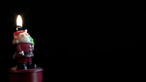 Free Stock Video Santa Claus Shaped Candle On Dark Background Live Wallpaper - Free Live Wallpaper